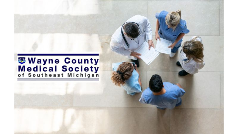 physicians standing in a circle - view from above. wcmssm logo on right of image